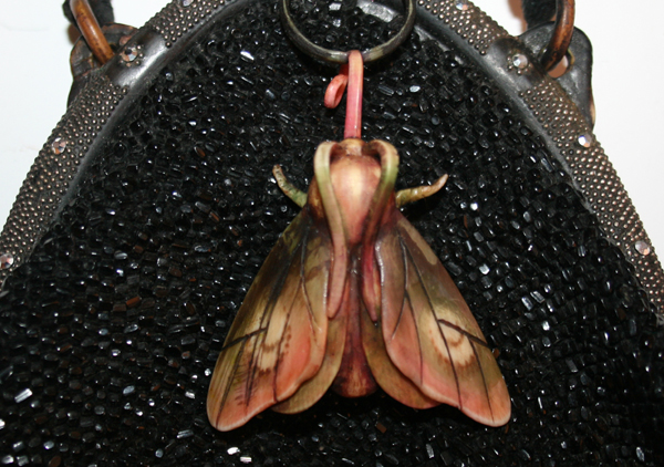 Moth celluloid purse